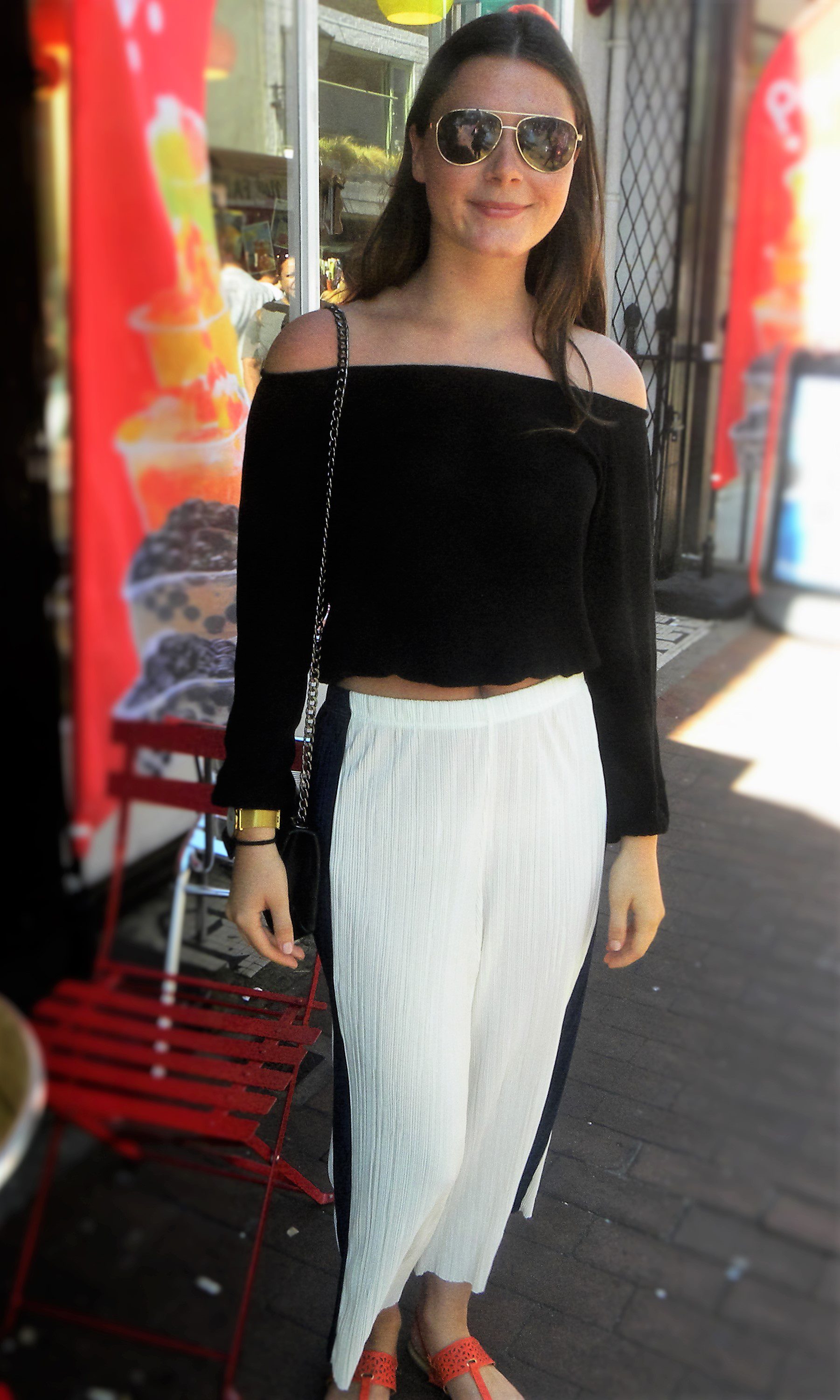 Isabel is wearing sunglasses from Timbaland, top from Brandy Melville and trousers from Top Shop.