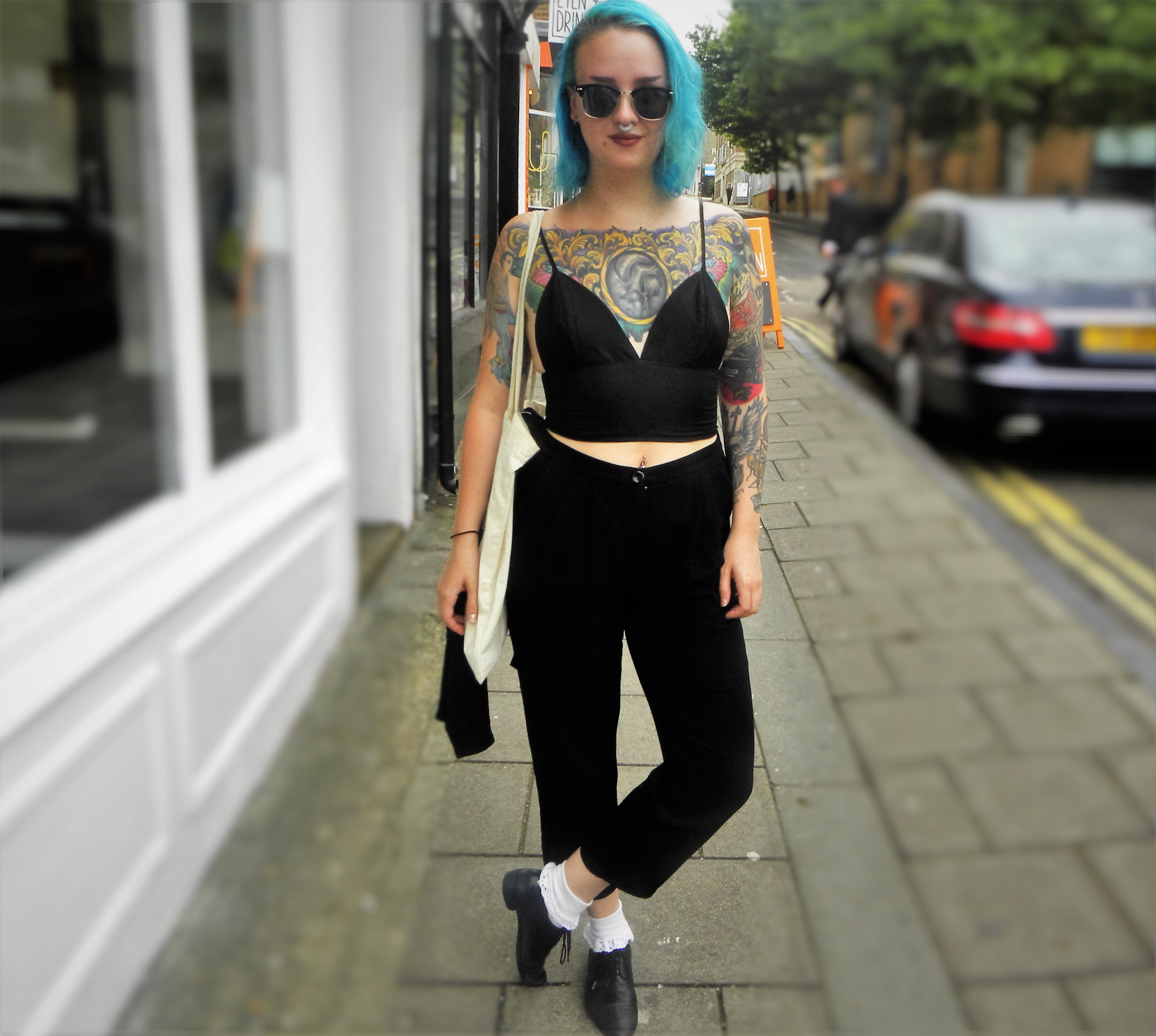 Luvan is wearing a top from Ebay, trousers from ?, shoes and sunglasses second hand from Germany.