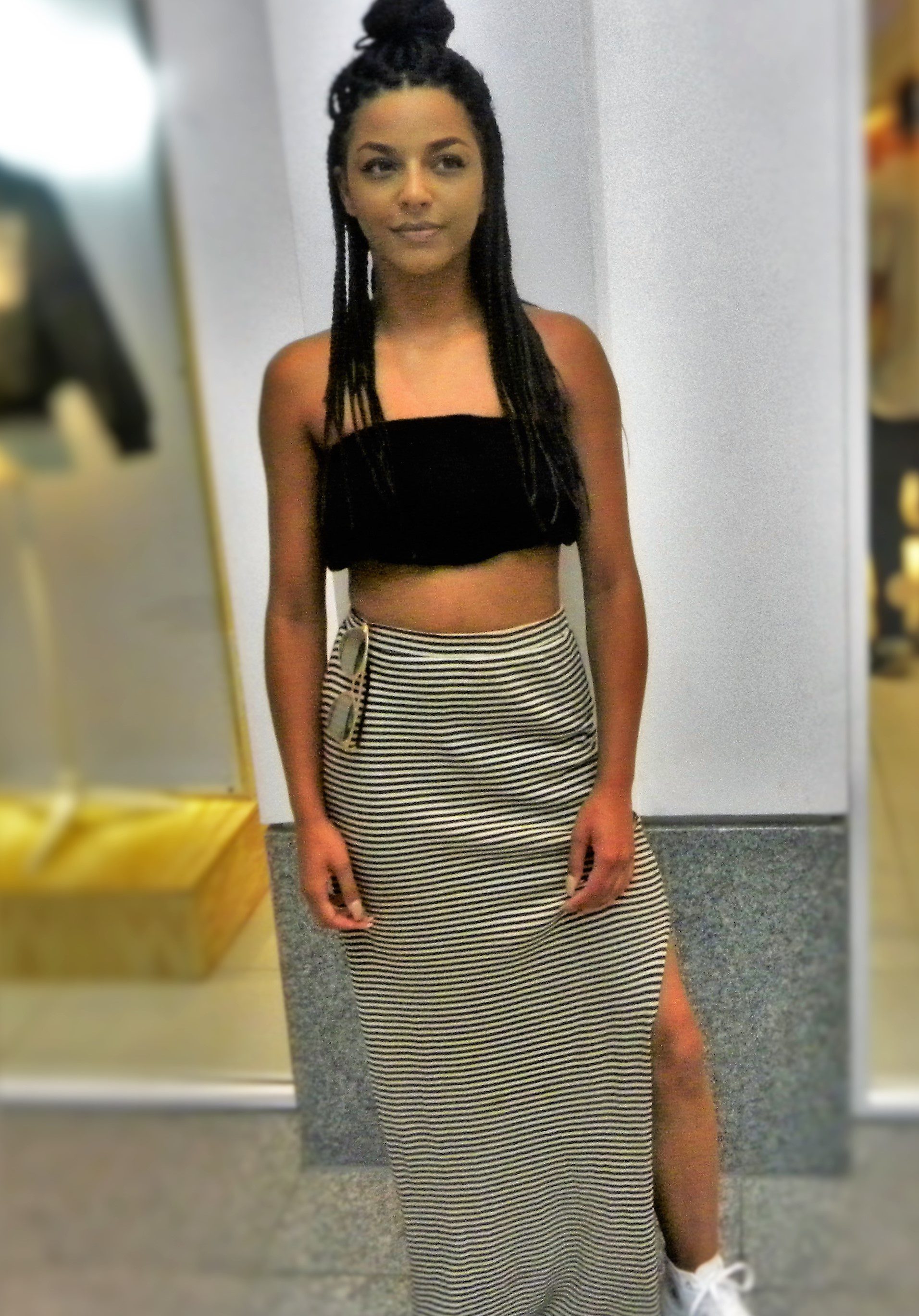 Jasmine is wearing a top fromTop Shop, skirt New Look, shoes Converse and sunglasses River Island.