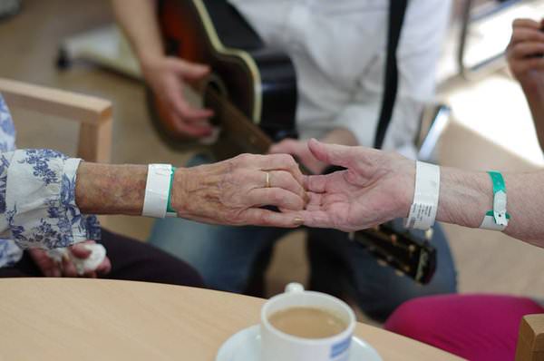 Patients holding hands