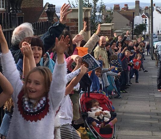Locals Lock Arms Around Brighton School to Defend Against Budget Cuts