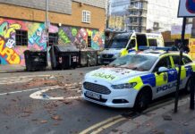Sussex Police Cars Damaged by Man Throwing Tiles From Brighton Roof