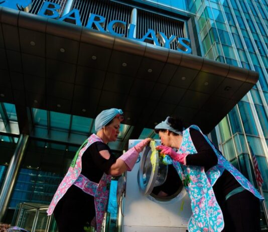 Extinction Rebellion protestors gather outside Barclays