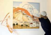 Artist defaces her own work in support of climate activism: “We’re lulling our way towards armageddon”
