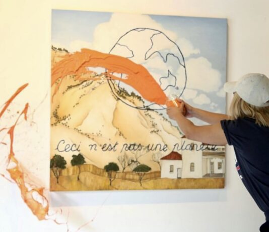 Artist defaces her own work in support of climate activism: “We’re lulling our way towards armageddon”