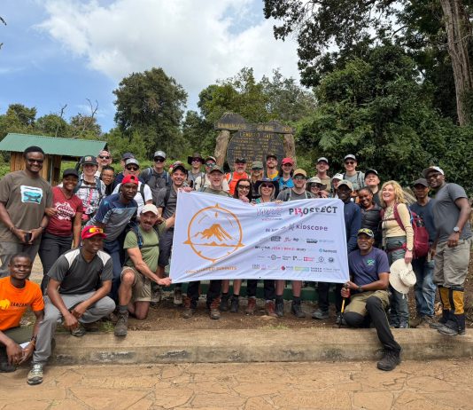 Celebrity Kilimanjaro Team Raises £100,000 at Ditchling Vineyard Kilimanjaro team with flag — Kidscape charity climb 2026