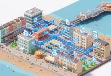 How Small Businesses in Brighton Can Use AI Automation to Save 10+ Hours a Week Isometric illustration of Brighton seafront buildings connected by AI automation workflow pathways showing email, invoice, and report processing flows.