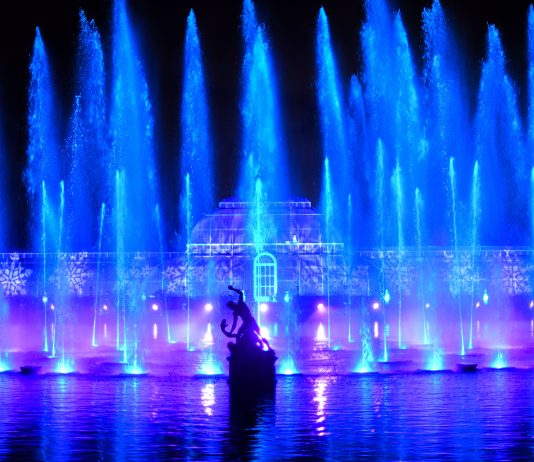 Christmas at Kew 2026: Exciting New Light Trail Opens 13 November Christmas at Kew light trail installation" / "Christmas at Kew Palm House Pond fountain display"