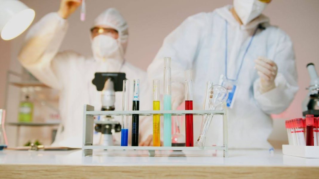 unnamed - 2026-10-24T185339.959 Researchers in lab coats working together at a laboratory bench courtesy of Artem Podrez on Pexels